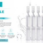 Five clear plastic concentrated facial ampoule serum vials displayed against a water droplet background.
