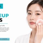 Model applying cosmetic powder with a soft precision pink makeup puff by Allmask cosmetics.